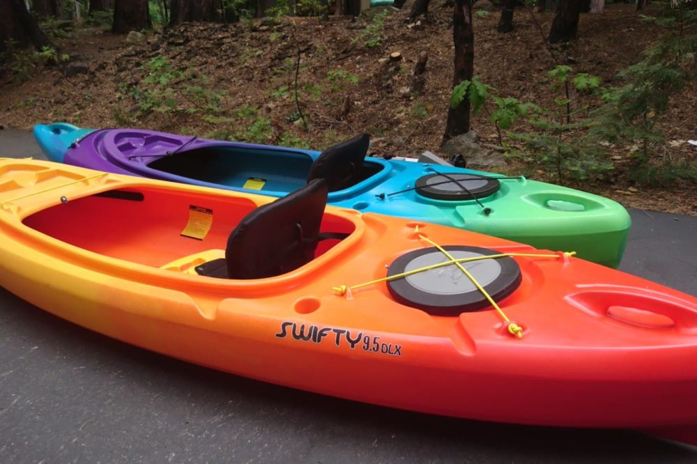 Dorrington Vacation Rental Cabins - Colorful kayaks parked in a parking lot near Arnold.