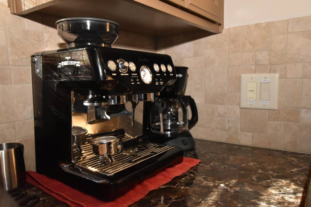 Dorrington Vacation Rental Cabins - A coffee machine on a counter in an Evergreen cottage.