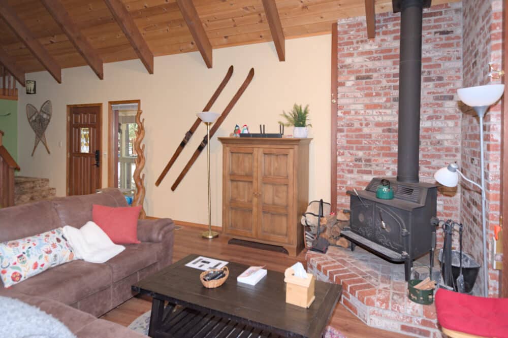 Dorrington Vacation Rental Cabins - A family-friendly living room with a fireplace.