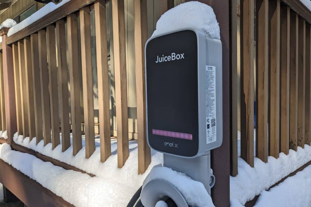 Dorrington Vacation Rental Cabins - A snow covered electric car charging station on a deck, making driving your EV to Arnold and Dorrington so easy!