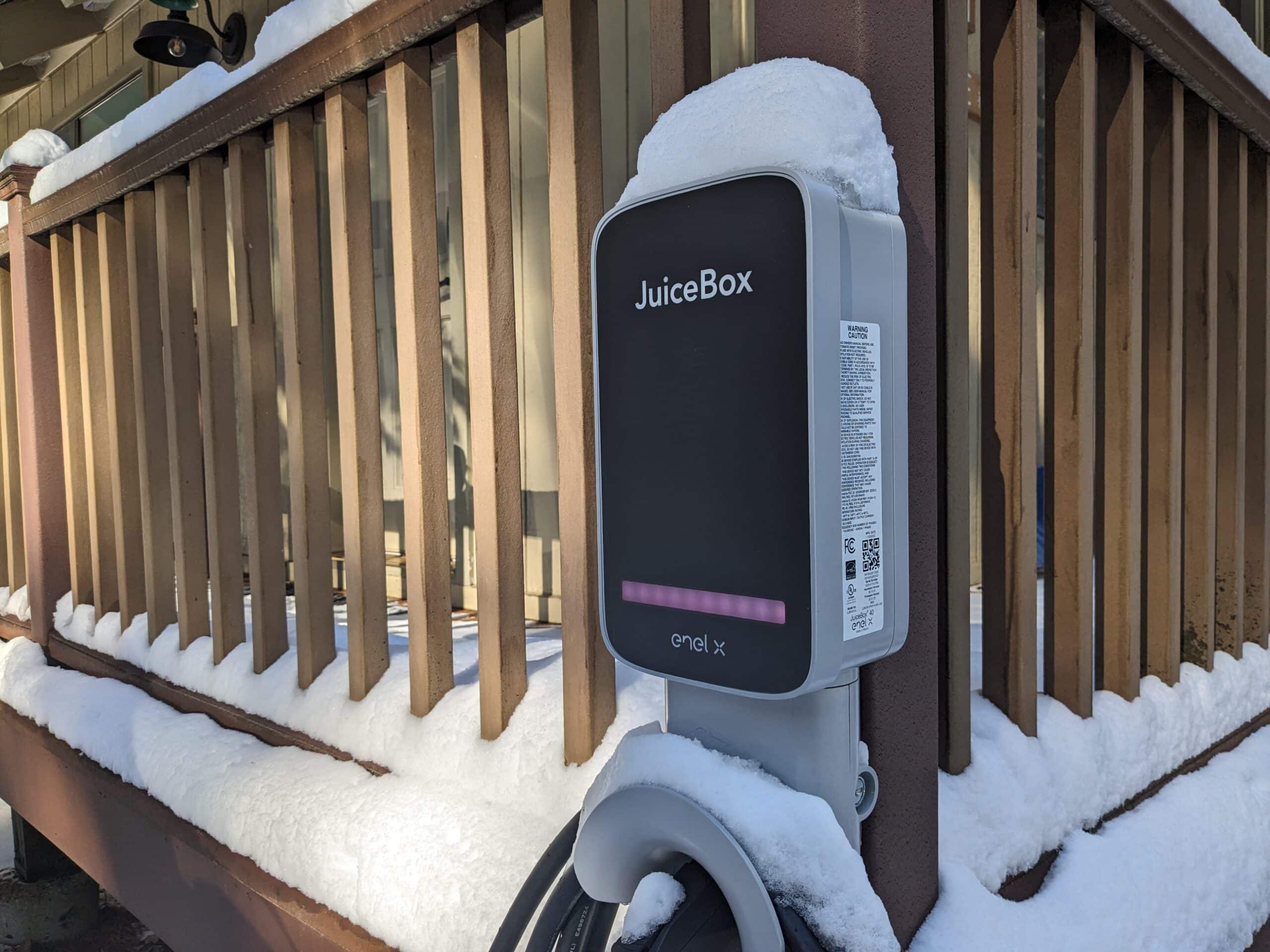 Dorrington Vacation Rental Cabins - A snow covered electric car charging station on a deck, making driving your EV to Arnold and Dorrington so easy!